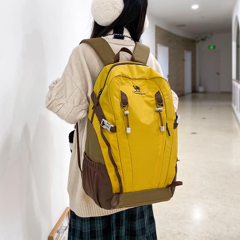 Large Capacity Camel-Style Backpack: Outdoor Travel & School with Spine Protection