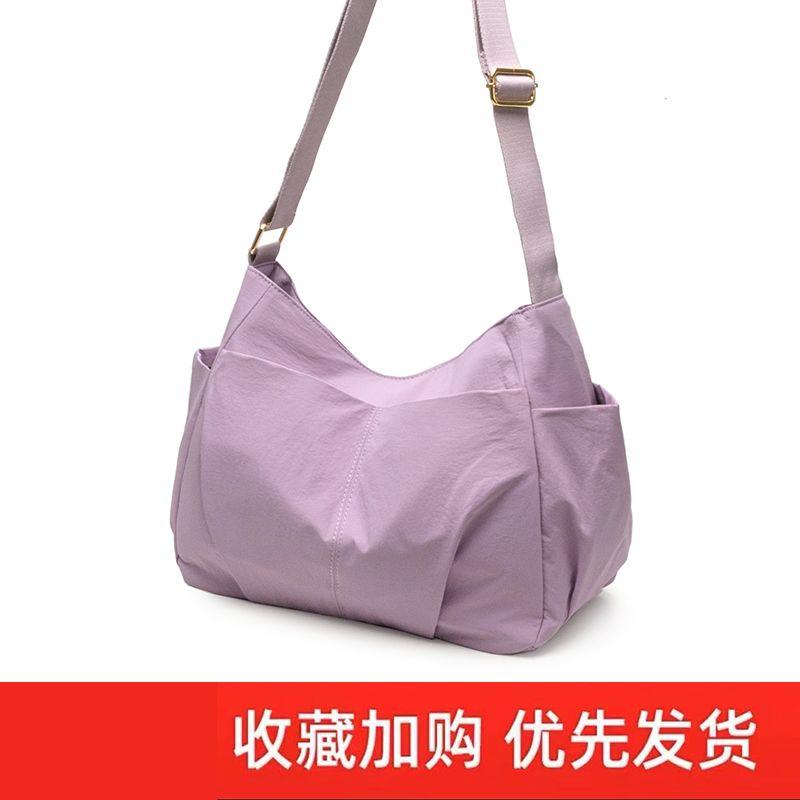 

Japan fashion Lightweight Multi-pockets Casual Waterproof Nylon Messenger Bag 2025 Niche Feeling Tong Qin Large Capacity Shoulder Cloth Bag Lilac pink purple
