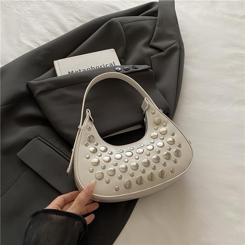 Einfache und modische neue Frühling-Achseltasche, Persönlichkeit, cool, mit Polka-Dot-Nieten, tragbare Knödel-Damentasche