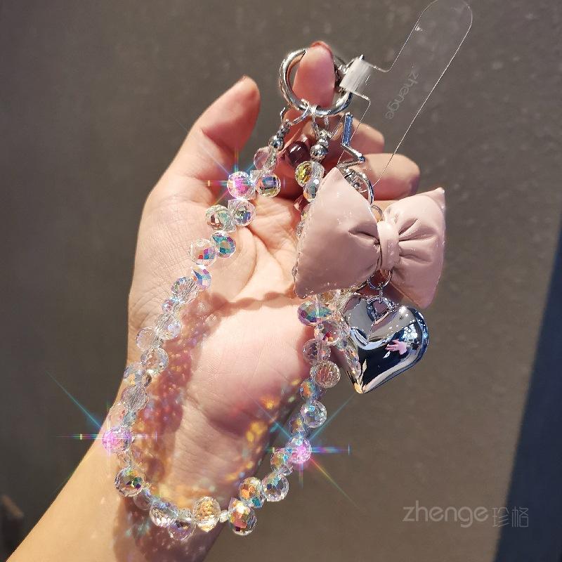 

Small fragrance bow tie, love mobile phone hanging chain, ins mobile phone case, pendant, beaded chain, short fashion women s wrist ornament [pale pink]
