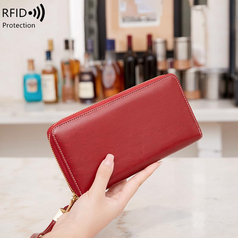 

New anti-theft brush women s wallet oil wax leather long zipper wallet large capacity clutch рожевий