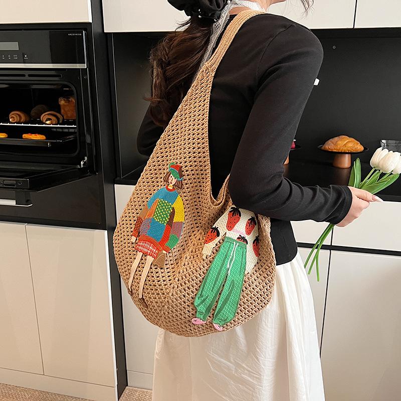 Summer hollow woven straw bag women's large capacity 2025 new casual shoulder bag seaside vacation wind beach bag