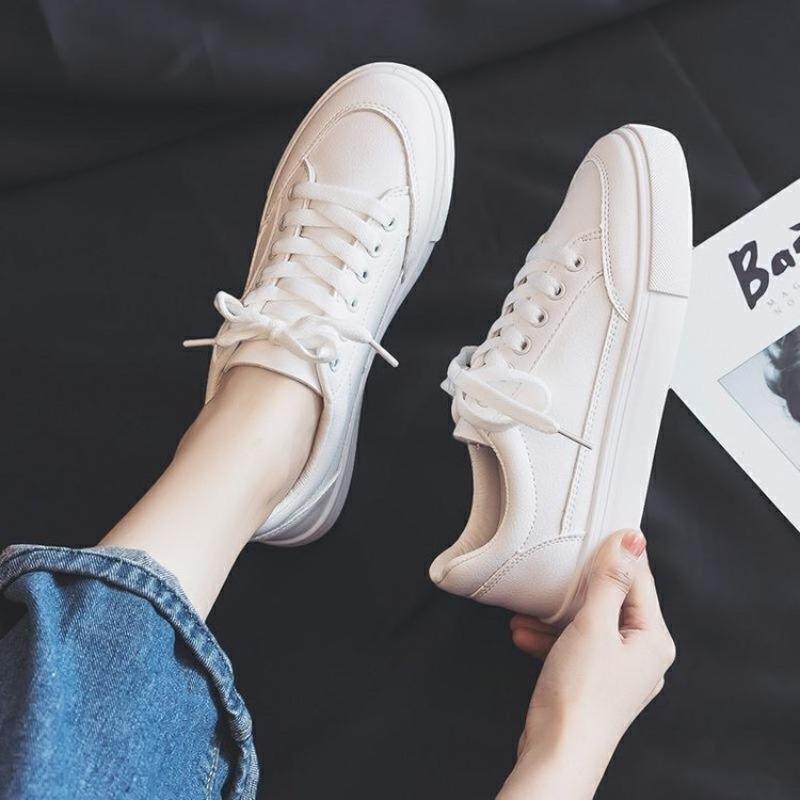 Studenten effen witte schoenen dames eenvoudige dagelijkse leren oppervlak vier seizoenen casual schoenen vetersluiting lage top platte zool dames board schoenen