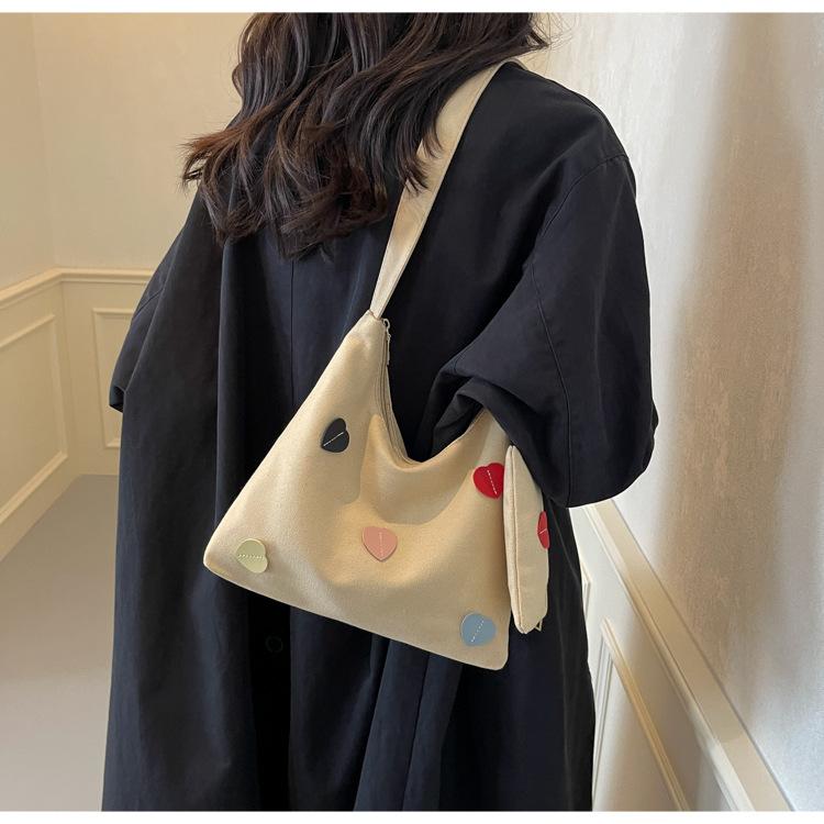 

Korean niche canvas bag women s 2025 new trendy autumn and winter casual shoulder bag sweet girl peach heart tote bag хаки