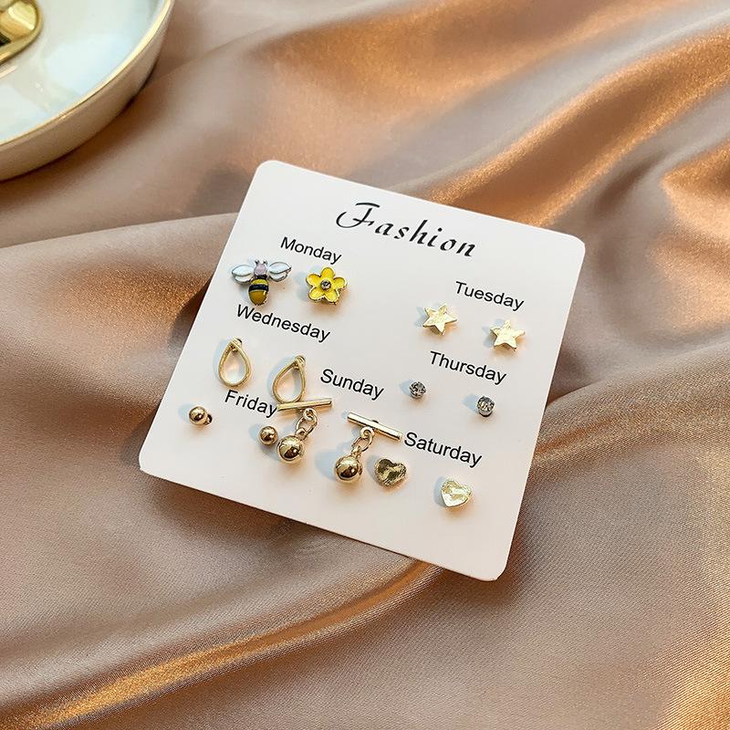 Korean version of small stud earrings one board student cute one week ceramic earrings set plated 911 jewelry pearl stud earrings women