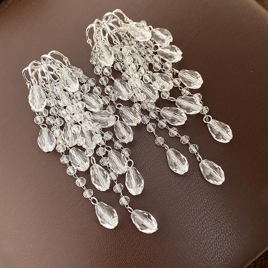 

Silver needle pearl water drop fringed earrings European and American cold wind temperament earrings light luxury high-end earrings