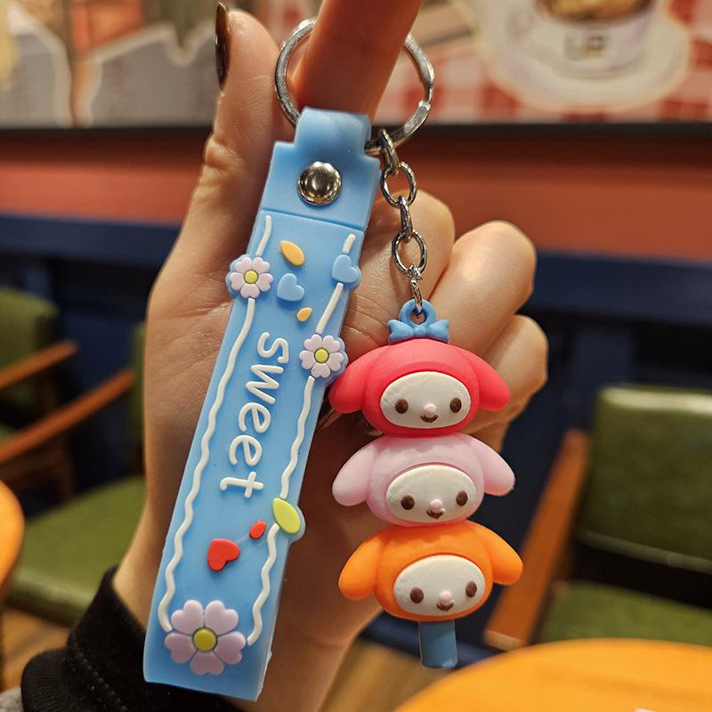 Yugui Dog Gestapelter Le Schlüsselanhänger Niedlicher Cartoon Melody Pudding Dog PVC Puppe Taschenanhänger