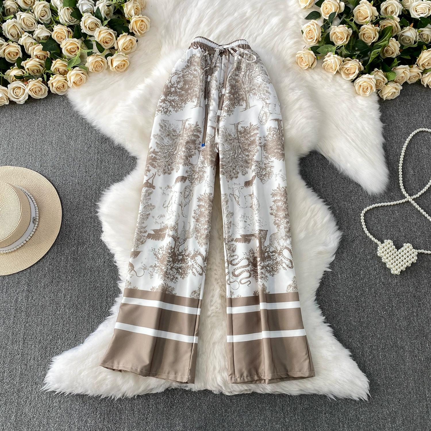 

Літні жіночі вінтажні дизайнерські штани з принтом у святковому стилі, тонкі широкі штани до щиколотки XXL світло-коричневого кольору