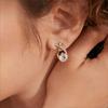 Gold Tone Teardrop Stud Earrings With Criss-Cross Cubic Zirconia Accents, Elegant Round-Cut Center Stone For Maximum Sparkle Comfortable Design