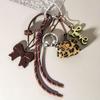 Exquisite Woven Maillard Bow Rope Pendant Earphone Gifts Mini Bow Faux Leather Bag Accessories for Women
