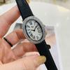 Oval-shaped women's watch with a vintage, luxurious feel and a high-end leather strap; fashionable quartz wristwatch.