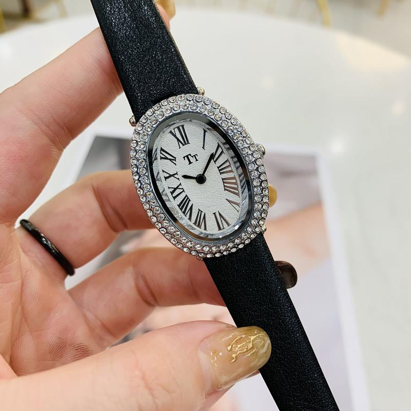 Oval-shaped women's watch with a vintage, luxurious feel and a high-end leather strap; fashionable quartz wristwatch.