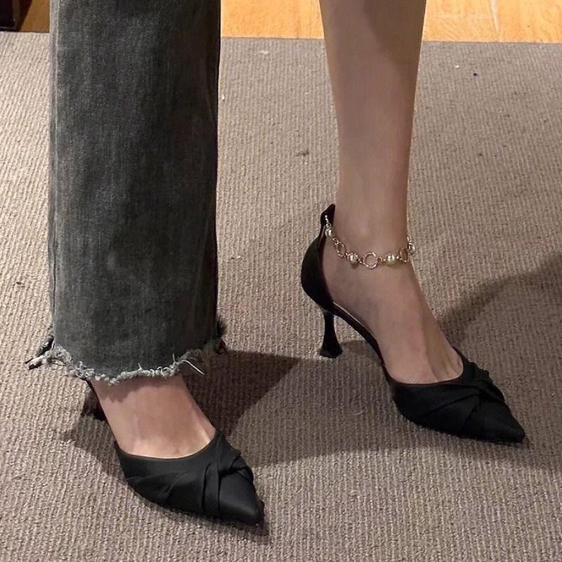 New black high heels women's design sense niche pointed pearl word with single shoes thin heel hollow