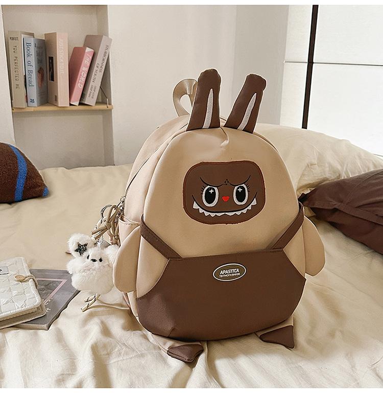 

Ugly and funny student backpacks are super popular, cute cartoon labu backpacks, lightweight and versatile backpacks No pendant коричневый