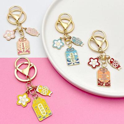 Japanese Sakura Koi Omamori Amulet Keychain for Luck, Wealth & Safety - Charming Couple's Accessory