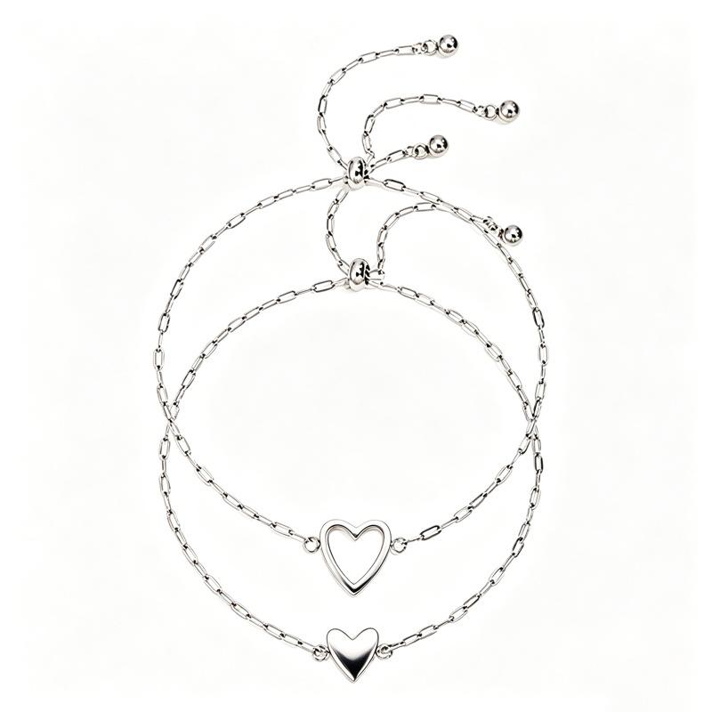 Simple and non-fading titanium steel hollow pull love couple advanced sense two-piece set casual versatile