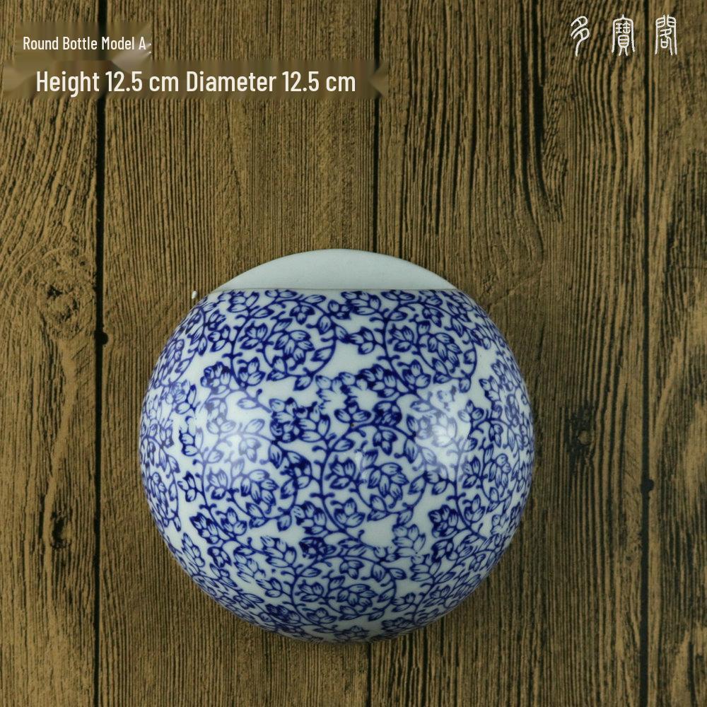 Hand-Painted Blue and White Ceramic Wall Vase with Floral and Bird Design