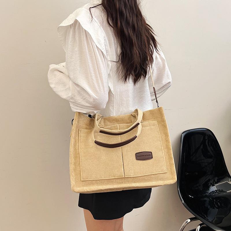 2025 new large-capacity commuter portable tote bag women's versatile strip velvet shoulder bag trendy wide shoulder strap messenger bag bag