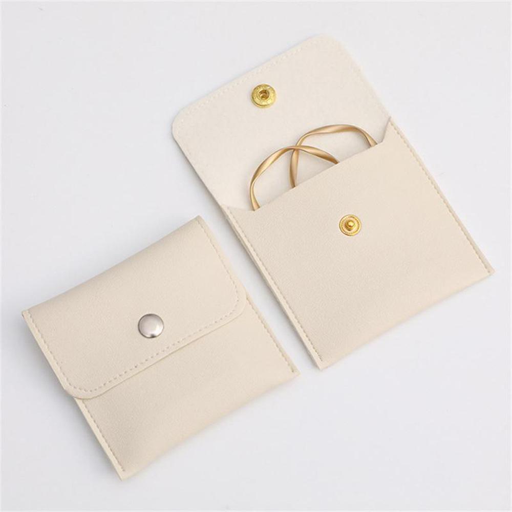 1 Stück PU Leder Schmuckverpackungsbeutel Halskette Ring Armband Ohrringe Organizer Aufbewahrung Druckknopf High End Mini Geschenk Schmuckbeutel KTY