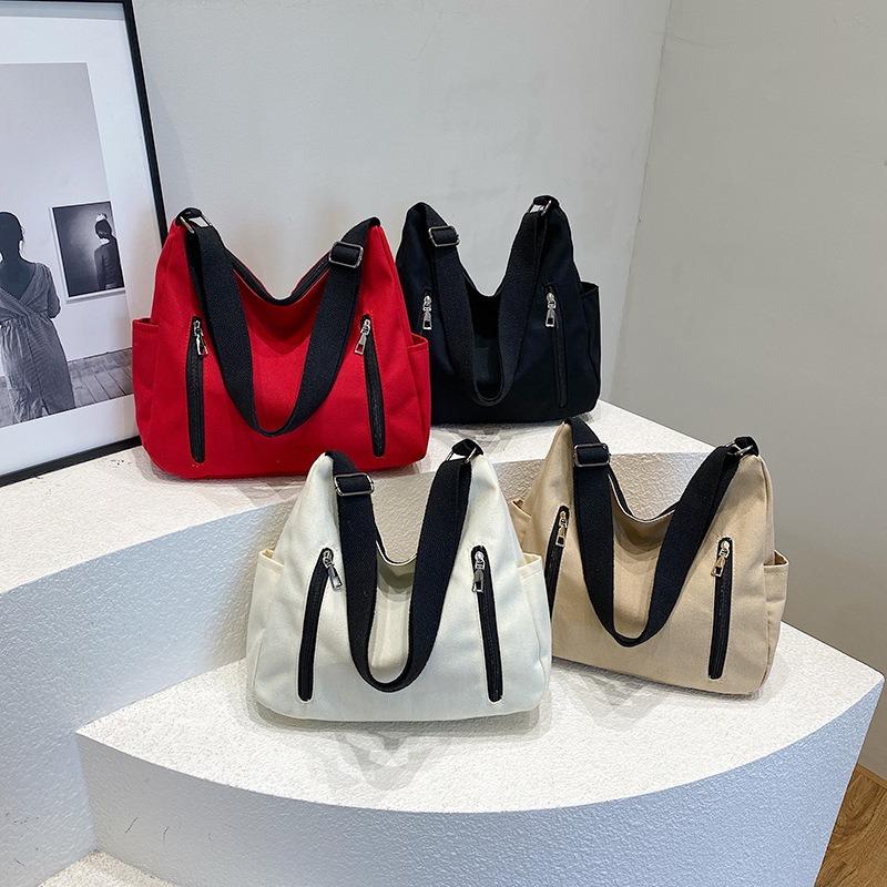 Neue einfarbige Damenhandtasche mit großem Fassungsvermögen, einfache lässige Tragetasche, trendige Mode, vielseitige Schulter-Umhängetasche