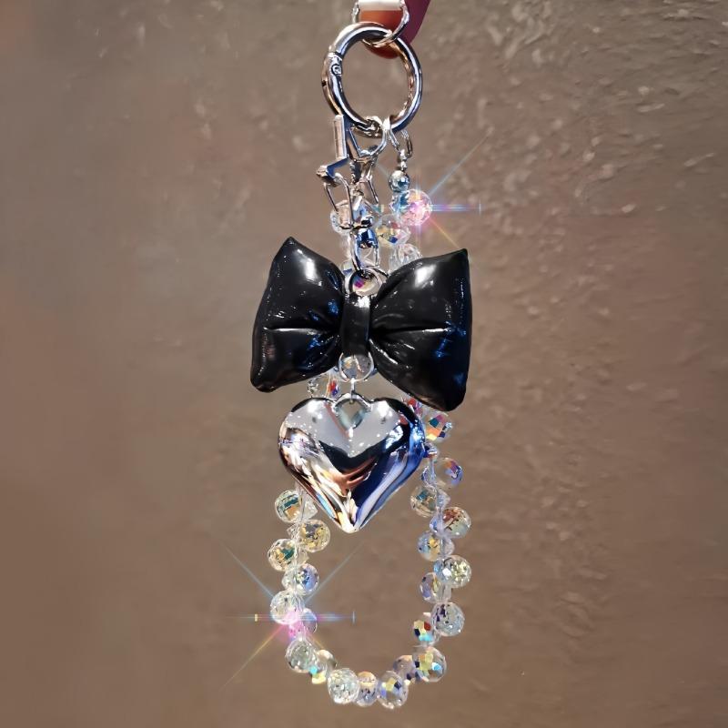 Ins style beaded phone wrist chain, love tie design, universal anti-lost short pendant lanyard for women outdoor shopping travel.