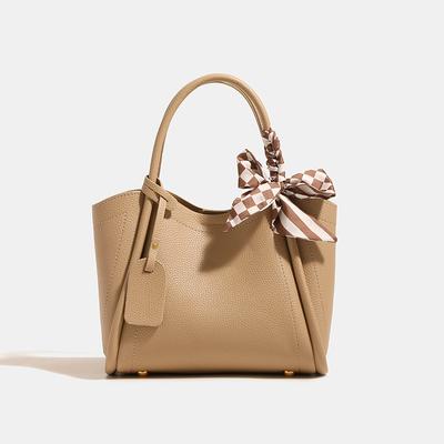 Large-capacity, Stylish, Versatile Commuting Bag Made of Soft Leather with A Lychee Texture. It Is A Single-shoulder, Crossbody, Hand-held Tote Bag