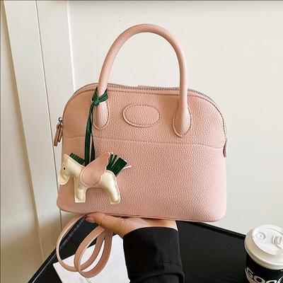 Sac à main de luxe léger premium Sac à dos simple de niche pour femmes Style étranger Sac coquille polyvalent