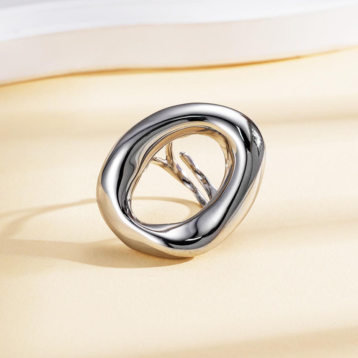 Luxury Geometric Stainless Steel Ring with Bold Lines and Irregular Hollow Design.