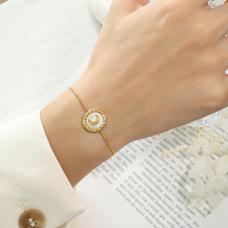 Women's Titanium Steel Jewelry Set: Crescent Moon Necklace, White Shell Earrings, and Non-Fading Bracelet.