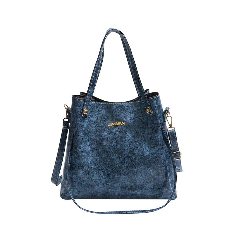Beliebte Taschen für Frauen Große Kapazität Neue Retro-Mode Breitbandige Einzel-Schulter Crossbody-Tasche Hand-Eimer-Tasche