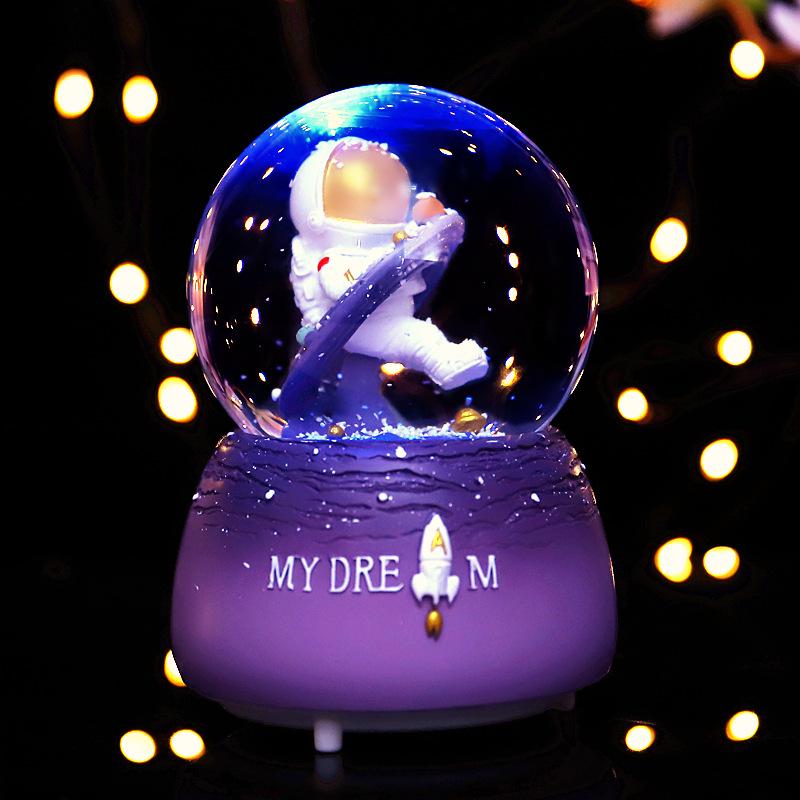 Adorno de Bola de Cristal Musical de Astronauta Nevado