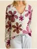 Women's Off-White V-Neck Knit Sweater with Blue Floral Pattern and Lace-Up Sleeve Detail