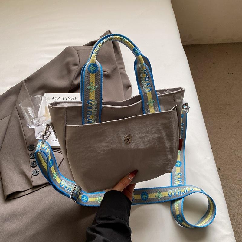 Large-capacity bag women's summer new versatile broadband messenger bag casual high-end portable tote bag