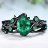 Bague bicolore noire et dorée avec zircon triangulaire vert olive