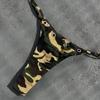 Cross Border Europe and America 2026 Summer New Camouflage Spicy Girl Hanging Neck Letter Printed Iron Circle Fashion Bikini Set