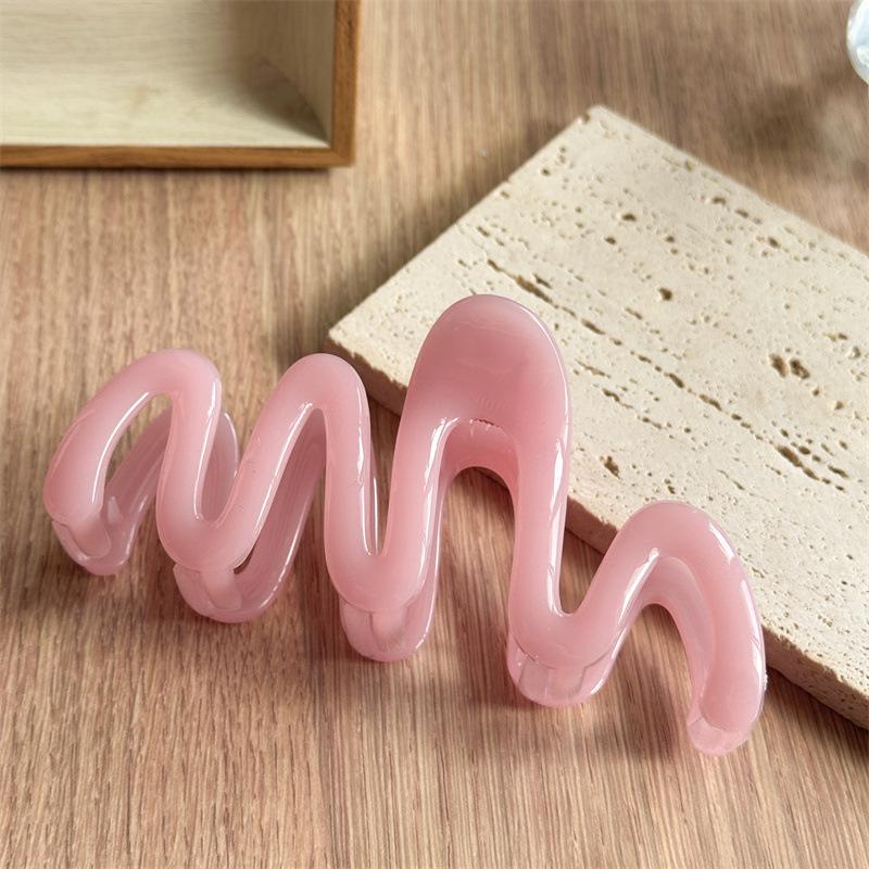 Fluid Wave Silhouette Hair Clip In Dreamy Translucent Hues Provides Secure Hold For Messy Buns And Modern Minimalist Updos Dopamine Pink