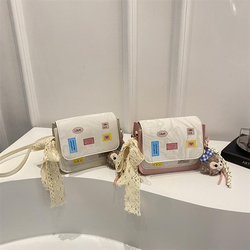 Versatile and foreign style spring new simple small square bag women's fashion high sense temperament light luxury design messenger bag