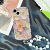 Artistic Oil Painting Flower Phone Case for iPhone 17 Pro Max/14, with 16E Bracelet and Blue Light Filter.