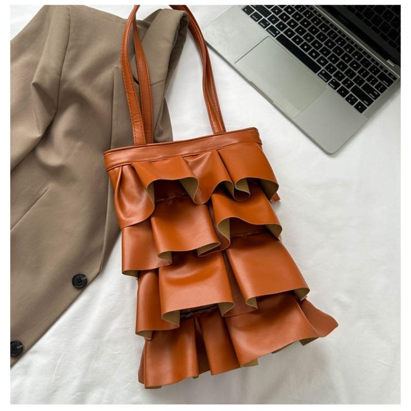 Neue Handtaschen sind trendige, einfarbige, personalisierte Plissee-Schultertaschen, modische und vielseitige Eimertaschen mit großem Fassungsvermögen.