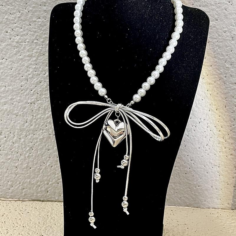 Love pendant collarbone chain pearl bead leather bow tassel necklace niche high-end necklace