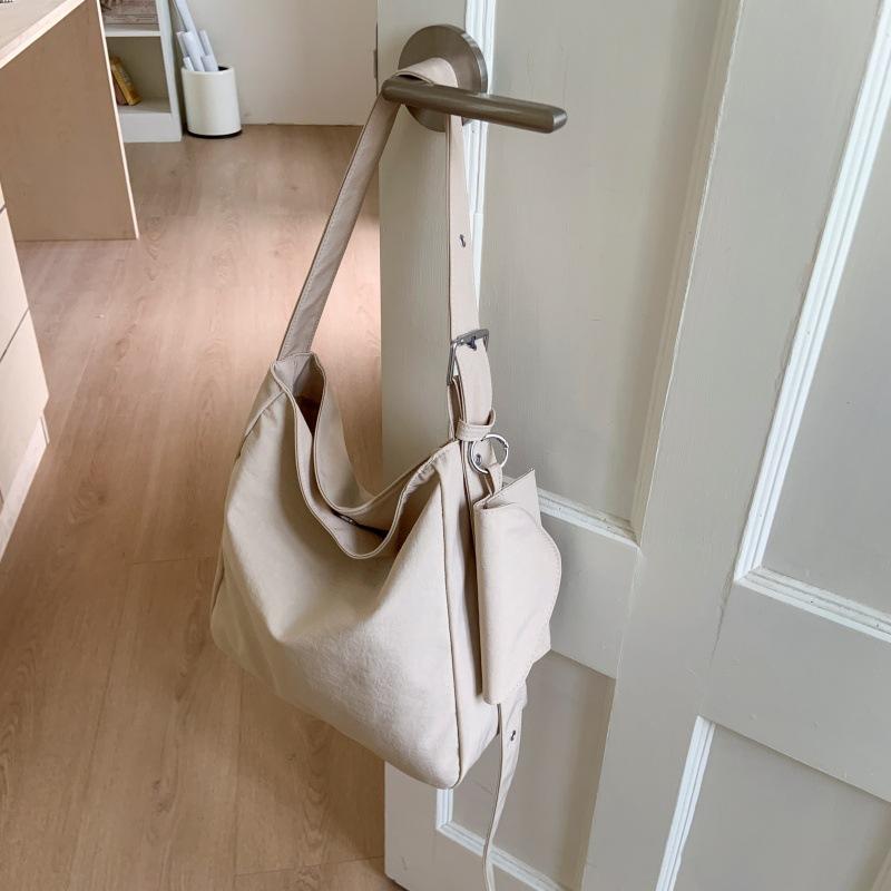 

2025 canvas messenger bag female mailman bag cloth bag class shoulder bag large capacity lazy wind tote messenger bag tide