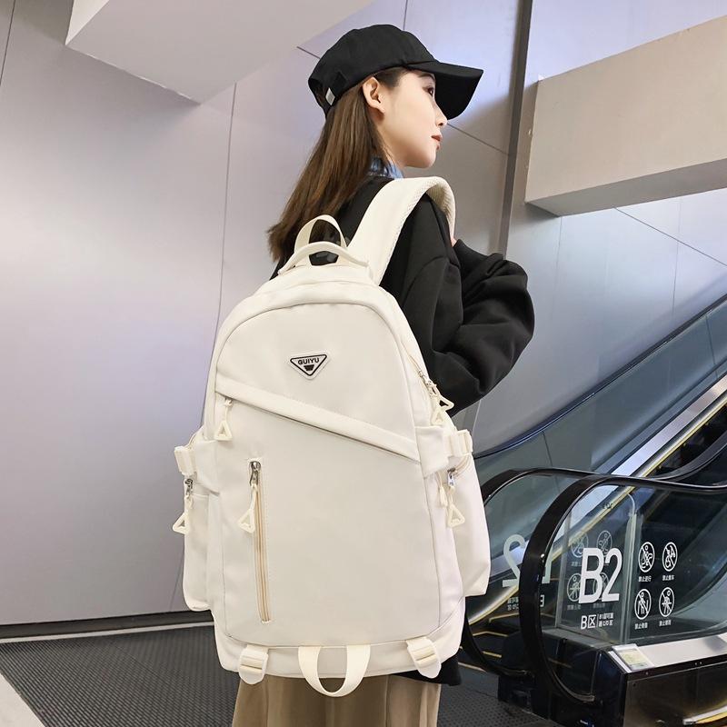 Nya trendiga skolväskor för mellanstadieelever Stor kapacitet Fritidsväskor för utomhusbruk för män och kvinnor Enkla trendiga och coola ryggsäckar