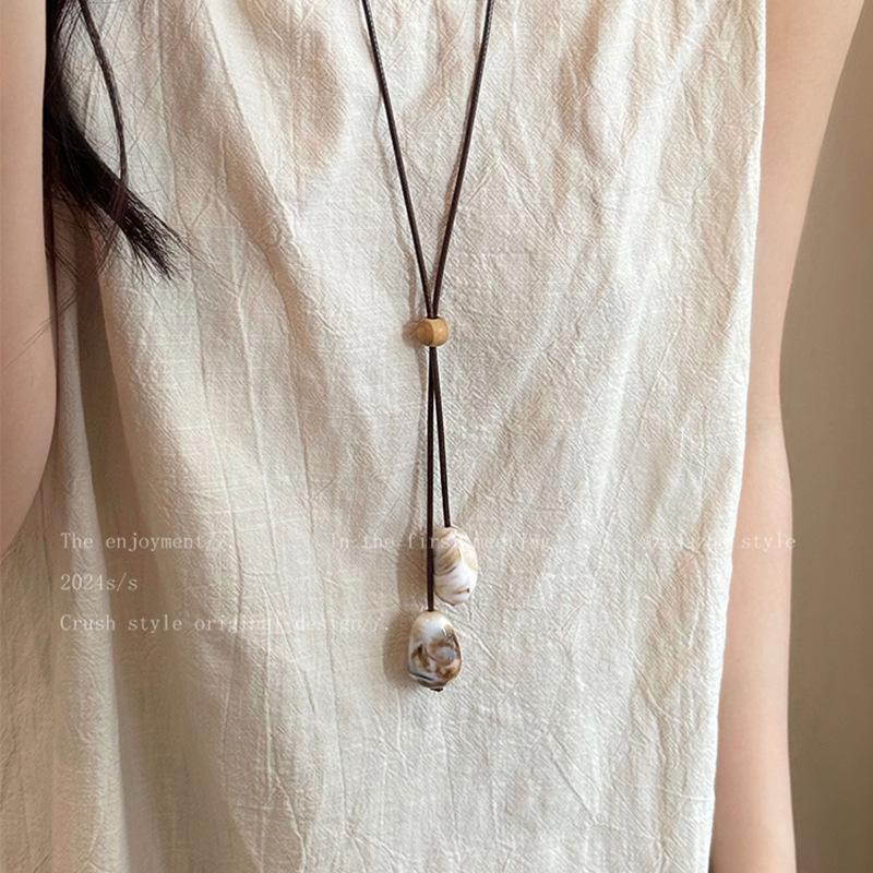 Irregular resin long necklace women's niche retro ethnic style wax rope sweater chain high-end sense item decoration