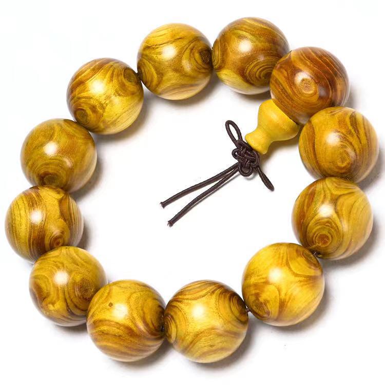 Exquisite Double-Eye Ghost Face Gold Thread Buddhist Bead Bracelet In Premium Wood