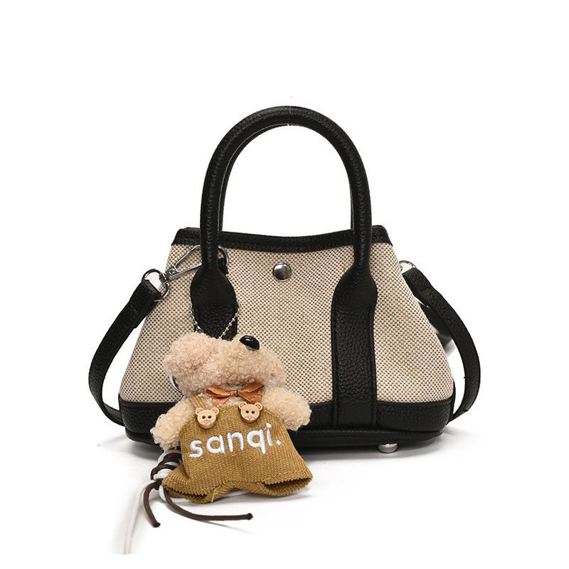 Korean version of casual niche contrasting color splicing portable bucket bag fashion versatile temperament casual commuter messenger bag woman