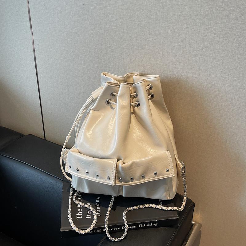 Korean Niche Backpack Bag Women's 2025 New Rivet Chain Multi-pocket Shoulder Bag Commuter Drawstring Bucket Bag