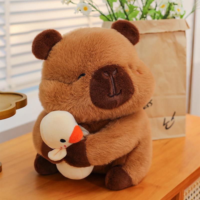 

Плюшевая кукла капибара с уткой - Мягкая набивная игрушка и подарок на день рождения для девочек 25cm (0.15kg)