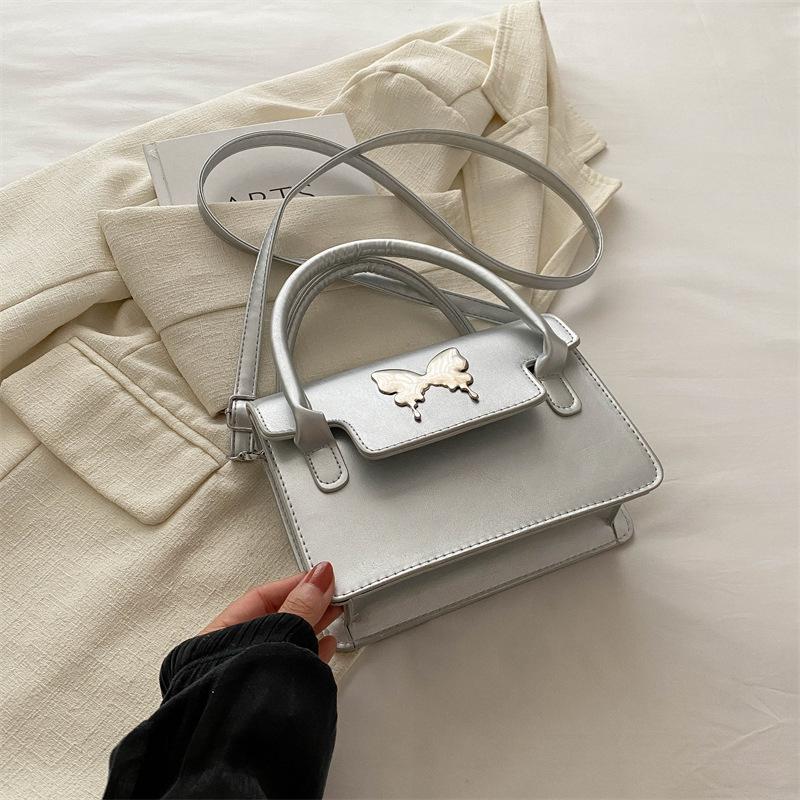 

2025 summer new Korean version fashion bow chain one shoulder underarm bag women s casual hand carry messenger bag tide серебряный
