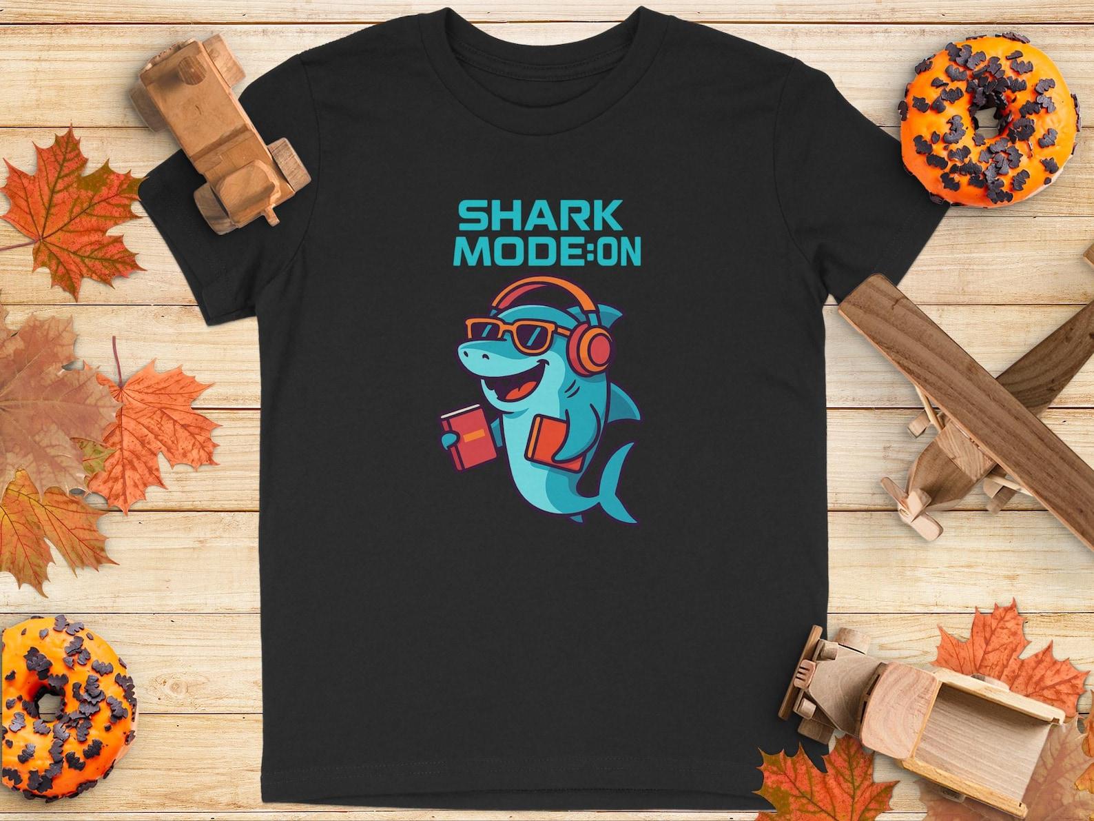 Shark Mode On Youth T-Shirt: Cartoon Shark with Headphones and Books 100