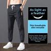 2023 Men's Korean-Style Ice Silk Casual Pants, Quick-Drying, Trendy, Loose-Fit Nine-Point Sports Pants for Summer.